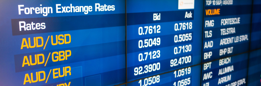 Digital board displaying foreign exchange rates for AUD/USD, AUD/GBP, and AUD/EUR with bid and ask prices.