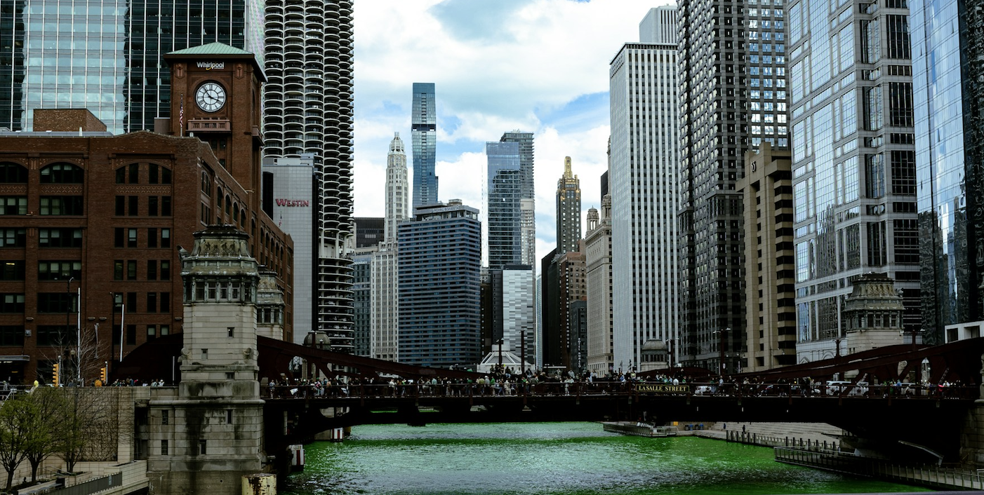 Chicago skyline along the river with downtown high-rises under an overcast sky