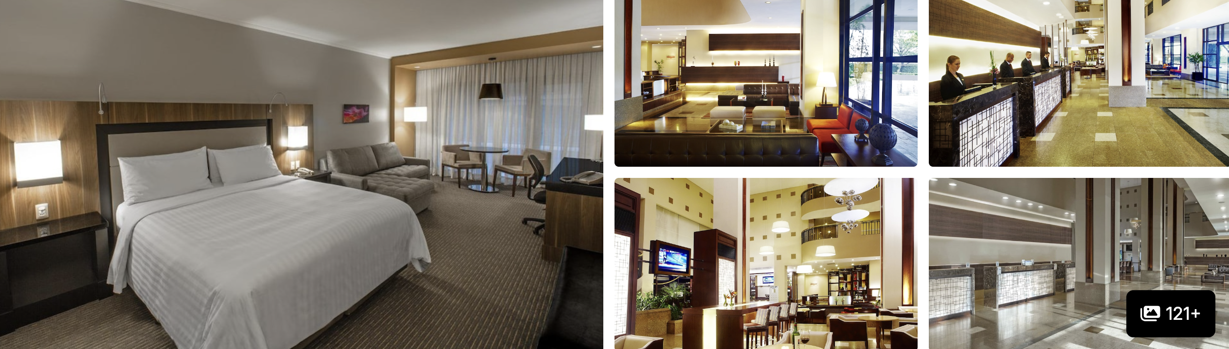 Comfort Hotel Guarulhos Aeroporto: glass exterior with Brazil and Sao Paulo flags, lobby, lounge and reception desk