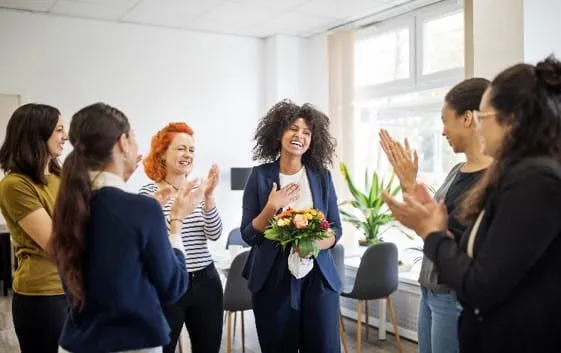 Colleagues celebrating in an office